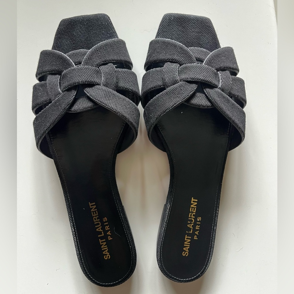 SAINT LAURENT Tribute sandal slides in black jeans